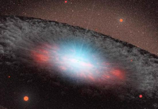 艺术示意图：位于星系核心的超大质量黑洞。图中的蓝色代表靠近黑洞区域的物质发出的大量辐射。周围灰色的部分则主要是尘埃和气体。