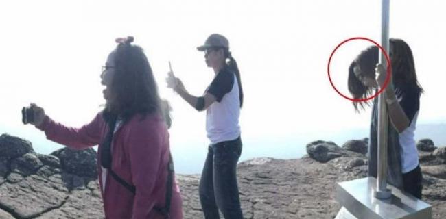 灵异：泰国女子在国家公园悬崖拍照 意外发现照片中多了一张老男人的脸