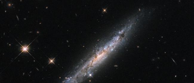 NASA公布哈勃太空望远镜拍摄到的罕见天秤座螺旋星系爆炸画面