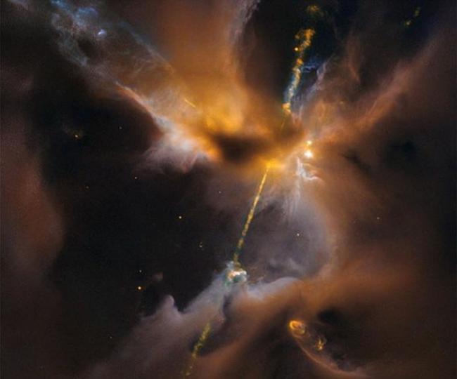 哈勃望远镜拍摄位于“猎户B分子云复合体”的“宇宙双刃光剑”