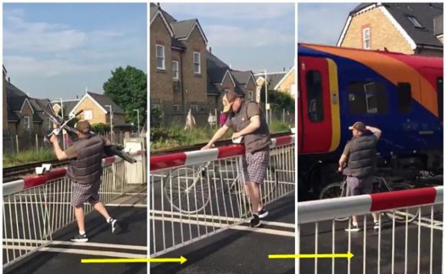 英国伦敦男子非法闯栏杆 险遭高速列车撞倒