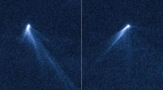 哈勃太空望远镜在9月10日和9月23日拍摄的可见光伪彩色图，它们显示，活跃的小行星P/2013 P5正向外喷出多条尘埃碎片尾巴