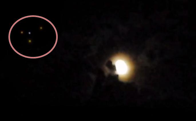 片段显示，月亮旁出现4点疑是来自UFO的光点。