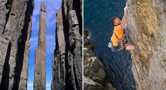 澳大利亚塔斯马尼亚半岛阿维海角的图腾柱迎来一群勇敢的攀岩爱好者