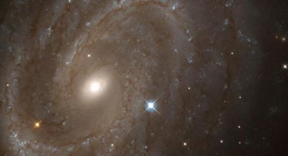如图所示，这是哈勃望远镜观测的螺旋星系NGC 4603，目前，科学家最新研究表明，过去几十亿年里宇宙星系出现了显著变形过程。