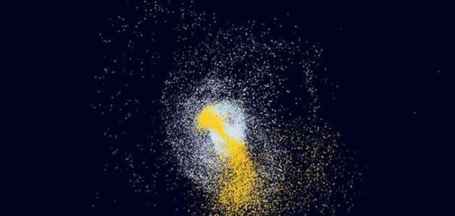 在这个数字模拟中，一个类似银河系的大型星系与一个较小的矮星系相撞。天文学家认为，在银河系发展的早期，至少发生过一次这样的大碰撞。